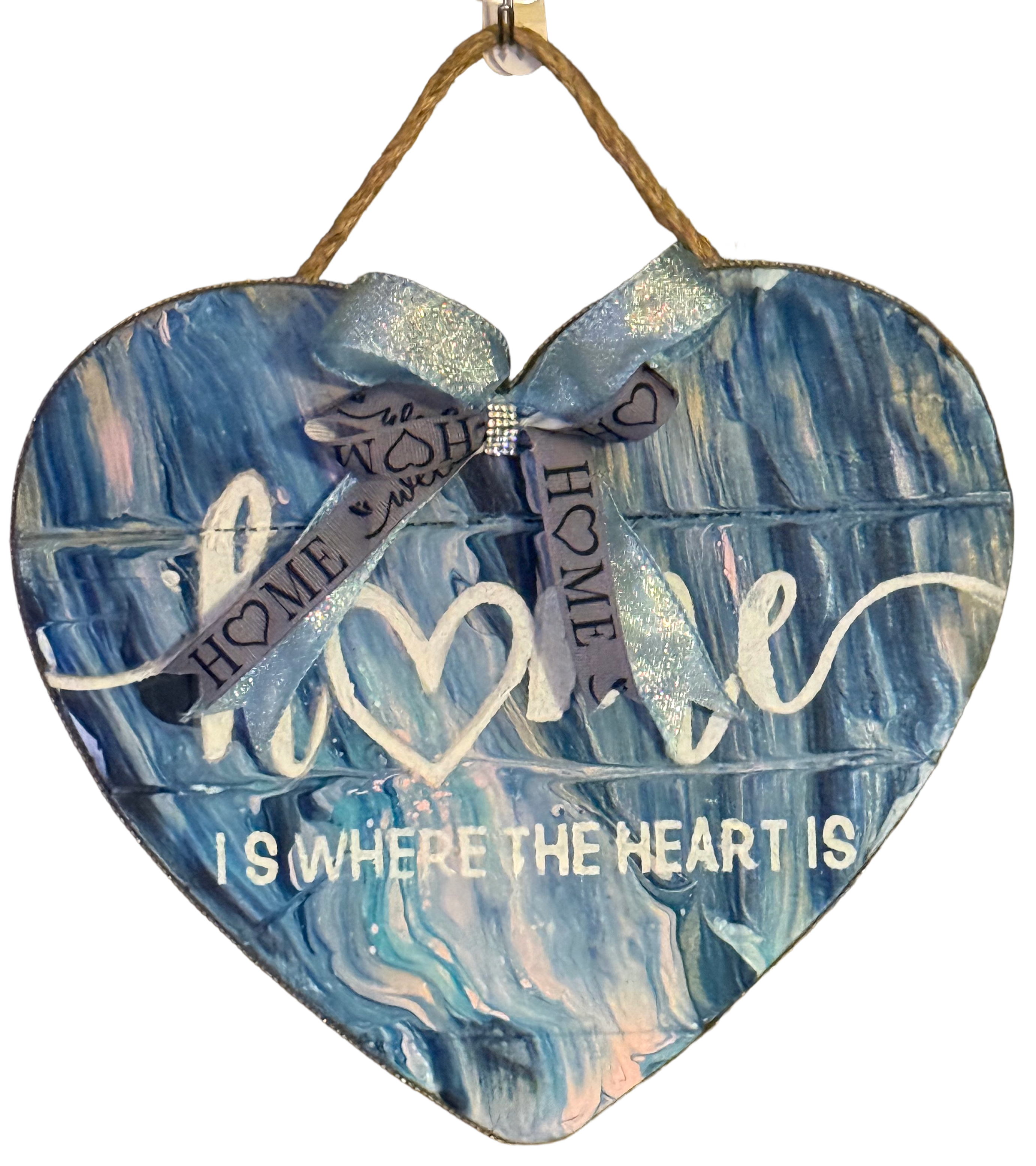 Heart-shaped wooden plaque with blue marbled design and text on a white background