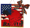Decorative wall hanging with American flag design and eagle silhouette, featuring a bow on a white background.