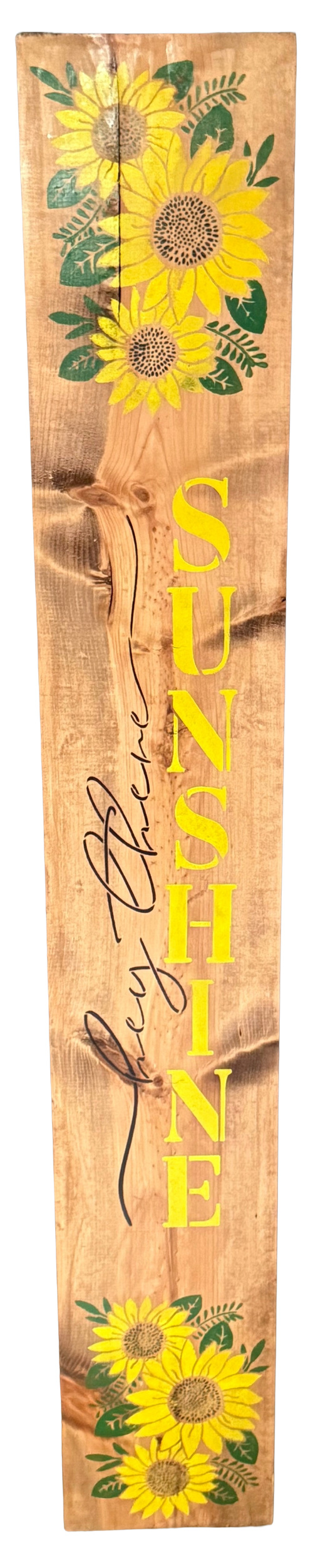 Wooden sign with sunflower designs and the word 'SUNSHINE' on a wooden background