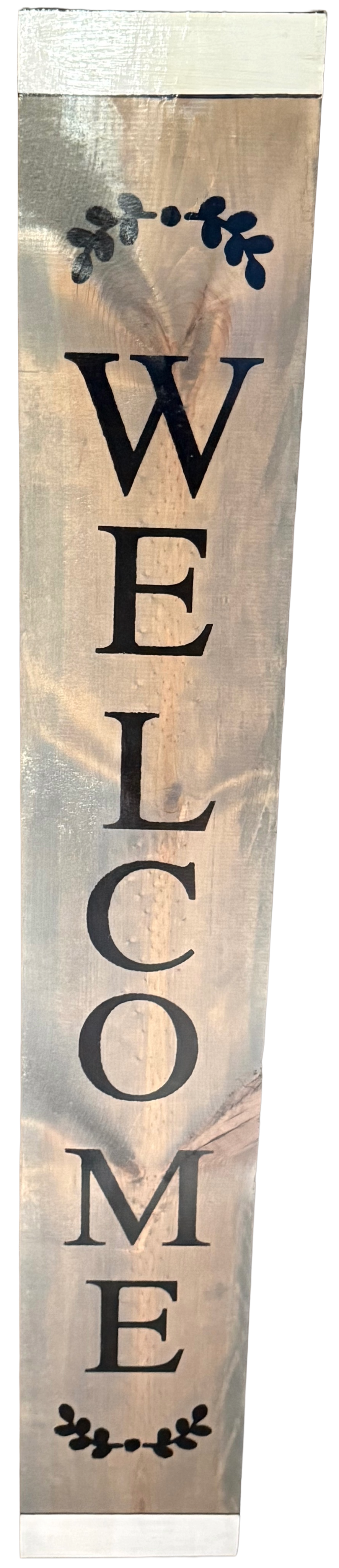 Wooden welcome sign with decorative elements on a light background