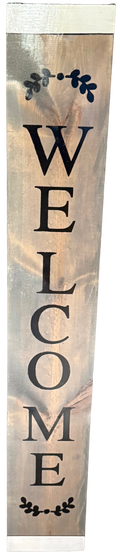 Wooden welcome sign with decorative elements on a light background