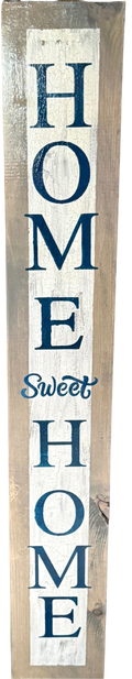 Wooden sign with 'HOME Sweet HOME' text in blue and white on a wooden background