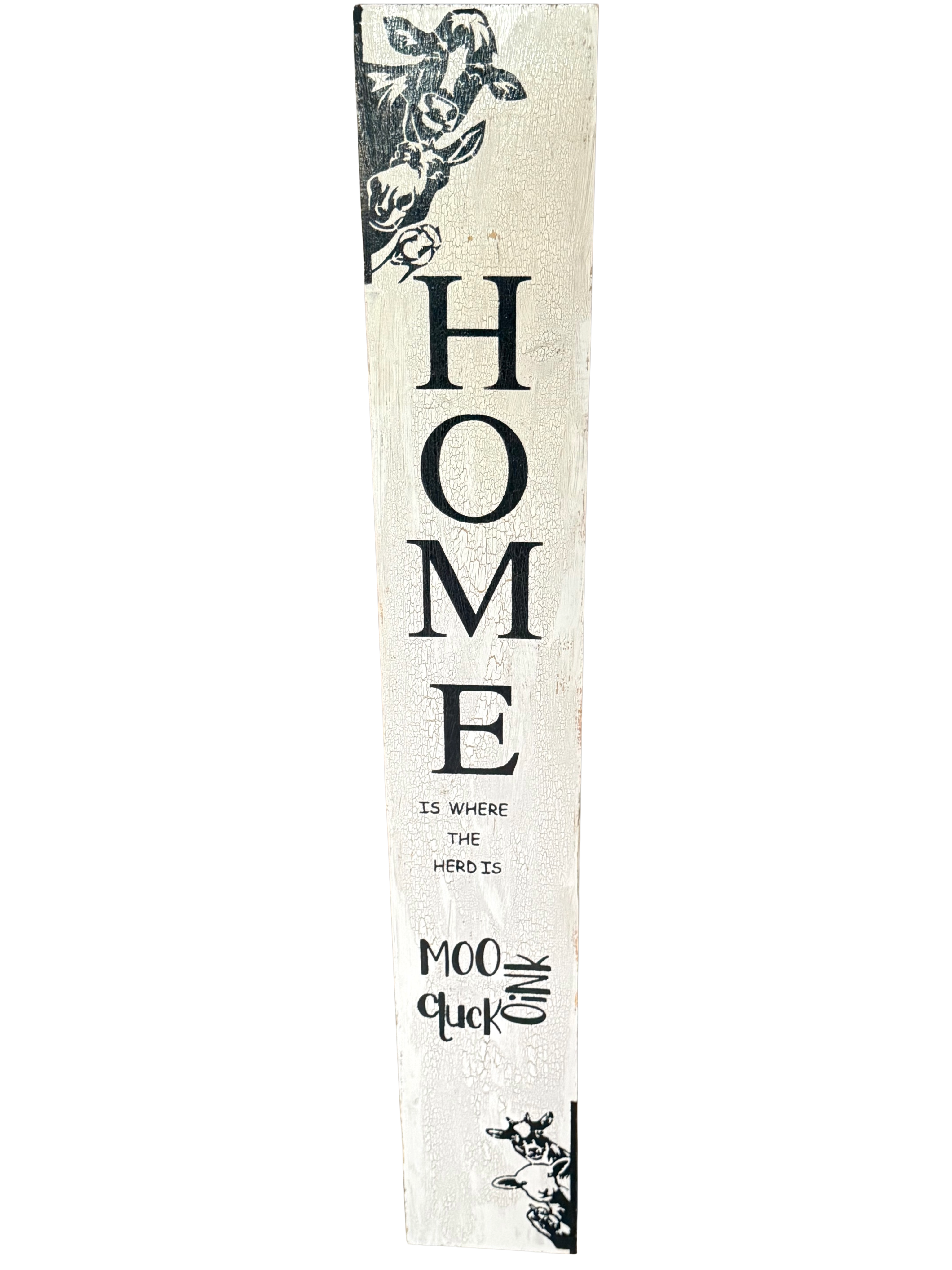 Decorative sign with 'HOME is where the heart is' text on a white background