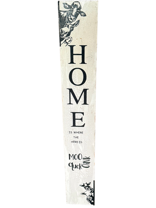 Decorative sign with 'HOME is where the heart is' text on a white background