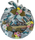 Round wreath with vintage truck and barn design, featuring flowers on a white background.