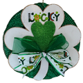 Decorative shamrock wreath with 'Lucky' text and green bow on a white background