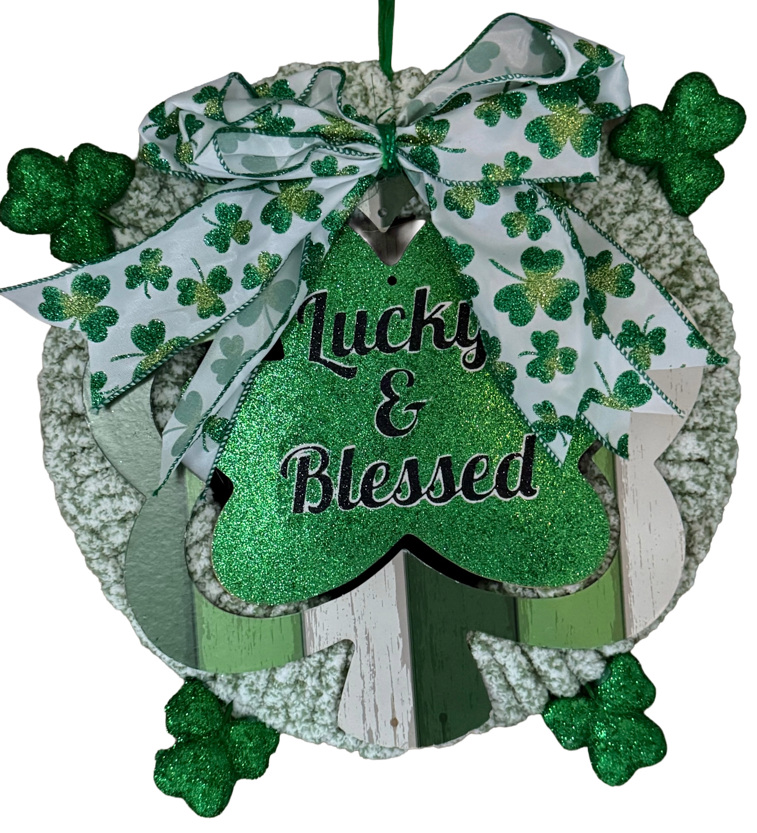 Decorative wreath with shamrock design and 'Lucky & Blessed' text on a white background