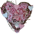 Heart-shaped decorative wreath with pink truck and hearts on a white background
