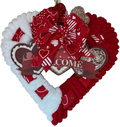 Heart-shaped wreath with red and white decorations on a red and white background.