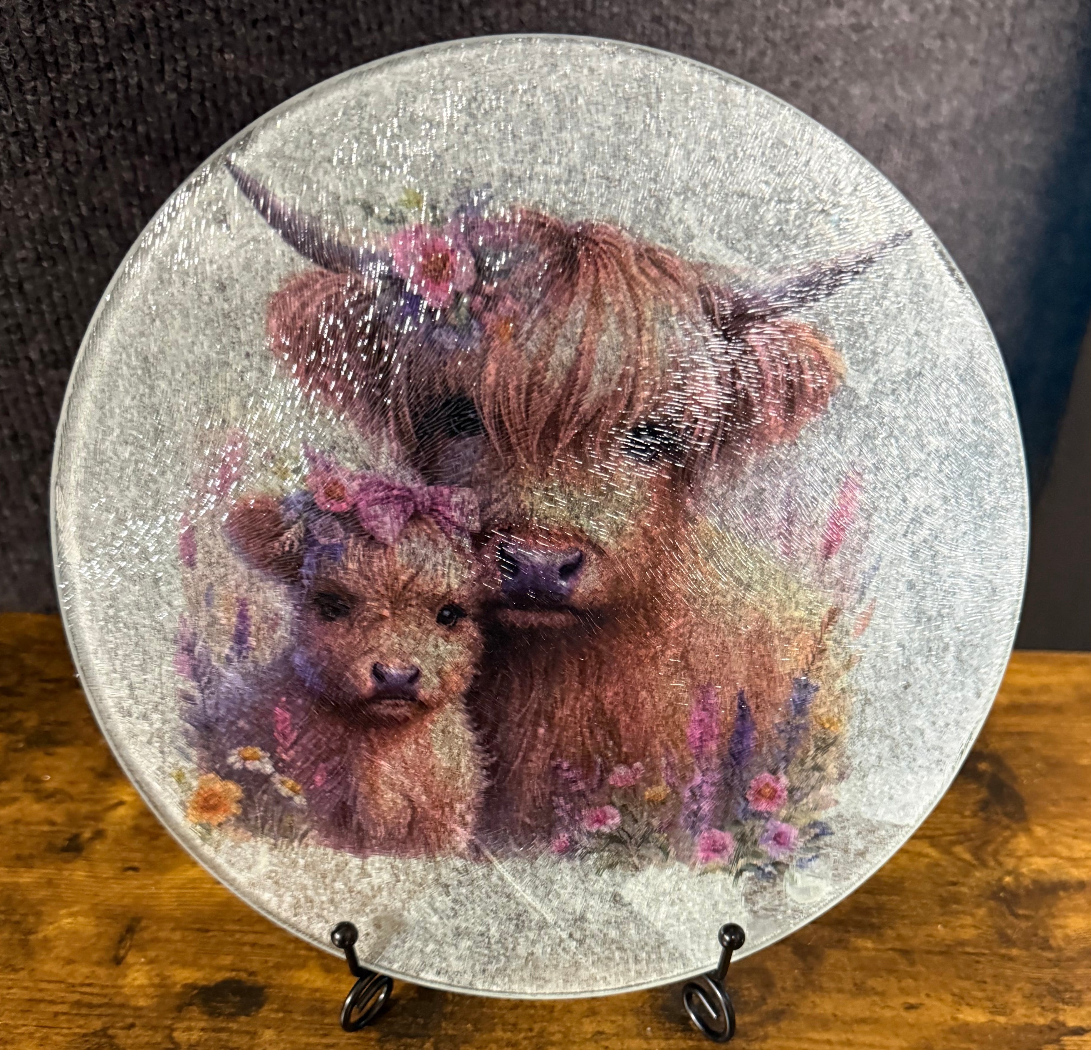 Round Trivet/hot plate with a bear design on a wooden surface