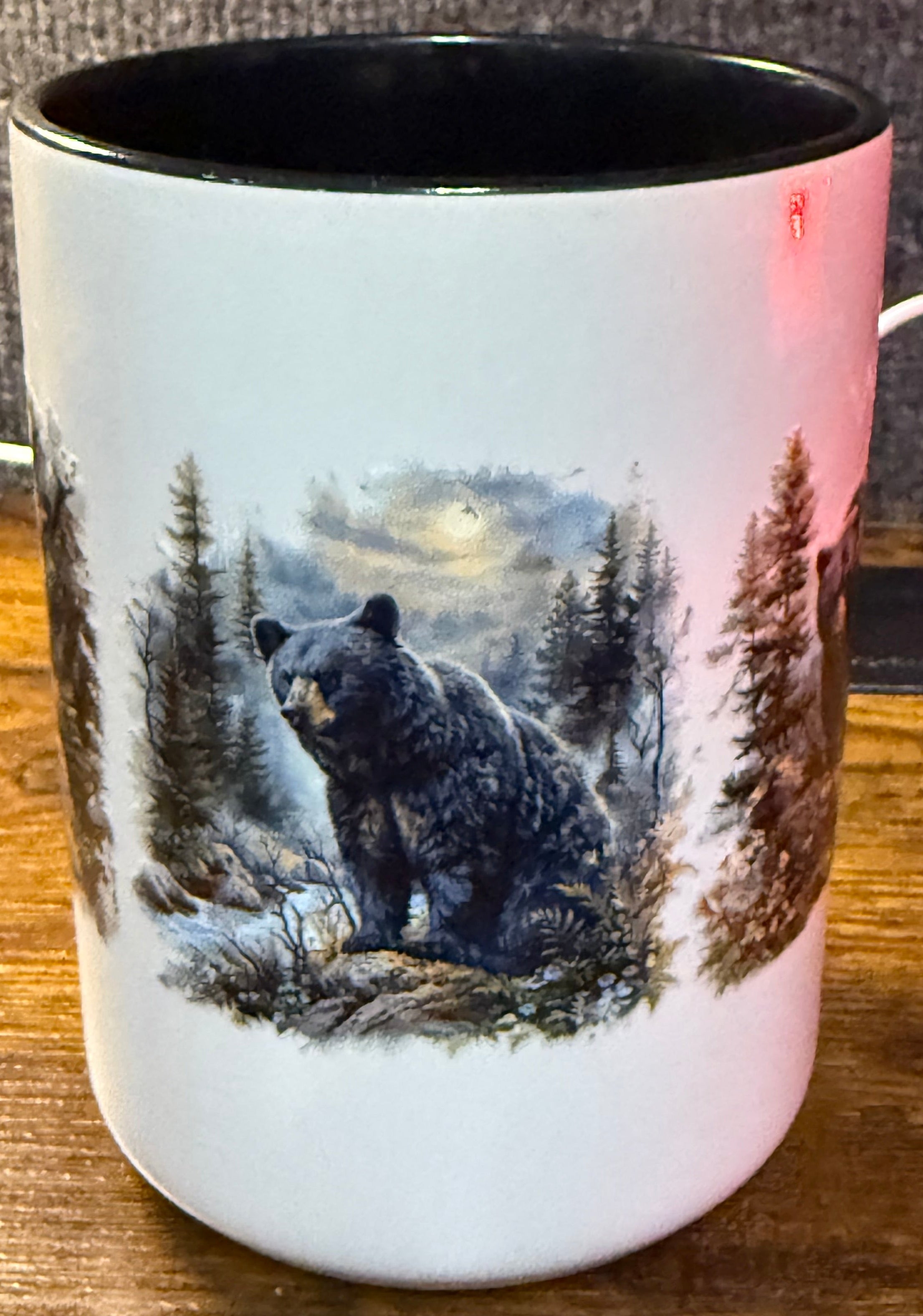 Mug with a bear design on a wooden surface