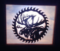 Lighted Shadow Box with scroll saw carving of a Moose in a gear done by hand with a rustic wooden frame.