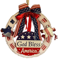 Decorative wreath ornament with 'God Bless America' text and American flag design on a white background.