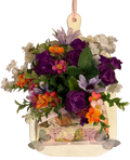 Decorative hanging basket with colorful flowers on a white background