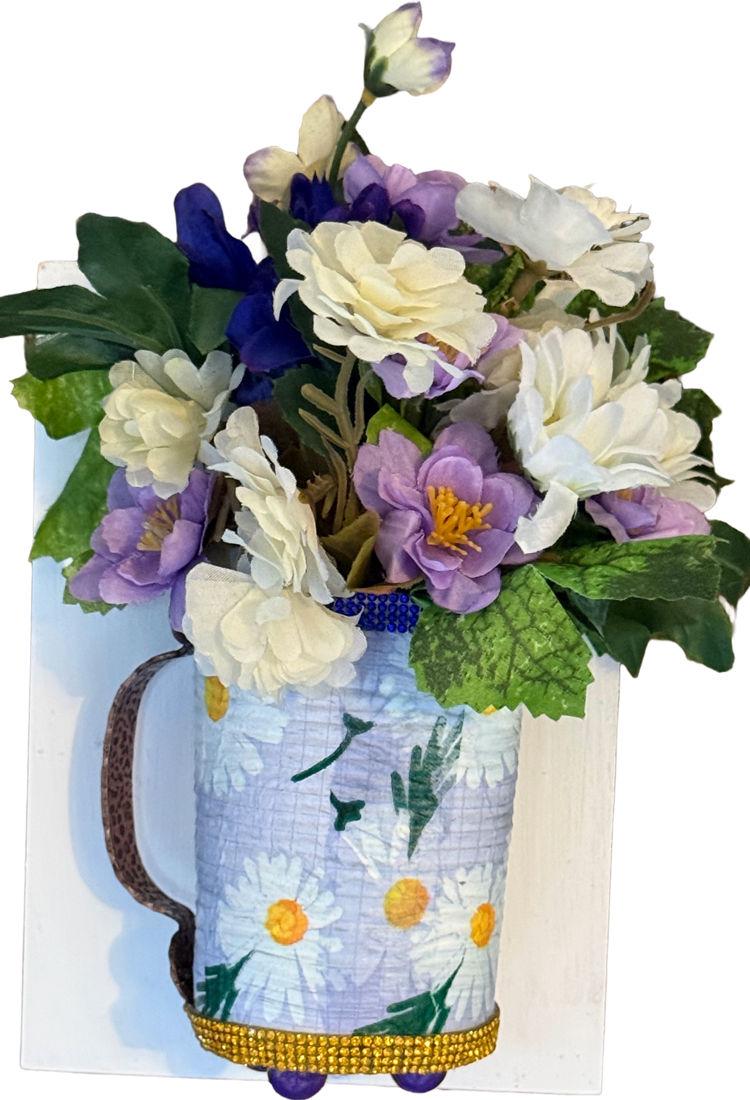 Decorative pitcher filled with flowers on a white background