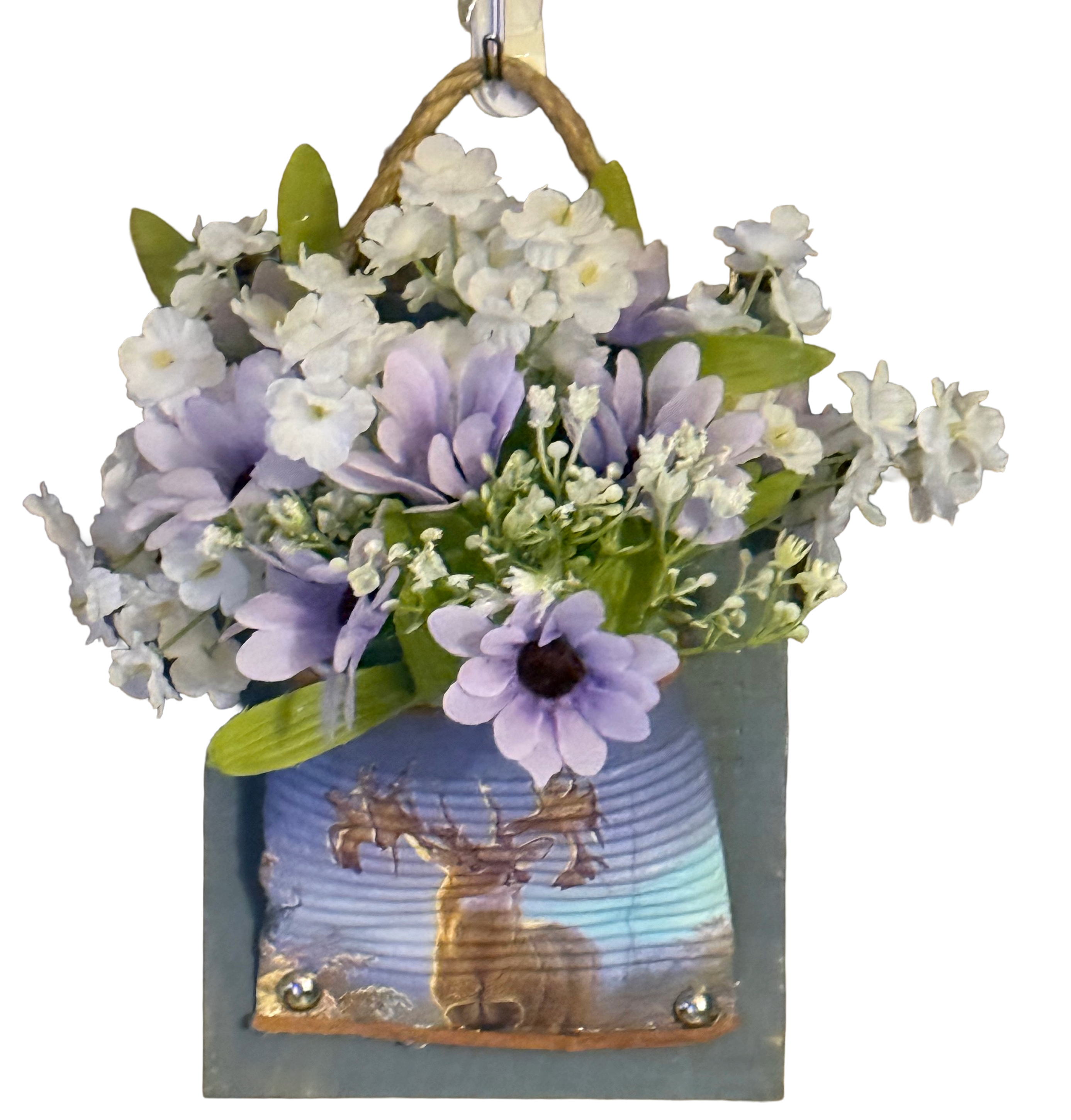 Decorative wall hanging with flowers and a deer illustration on a white background
