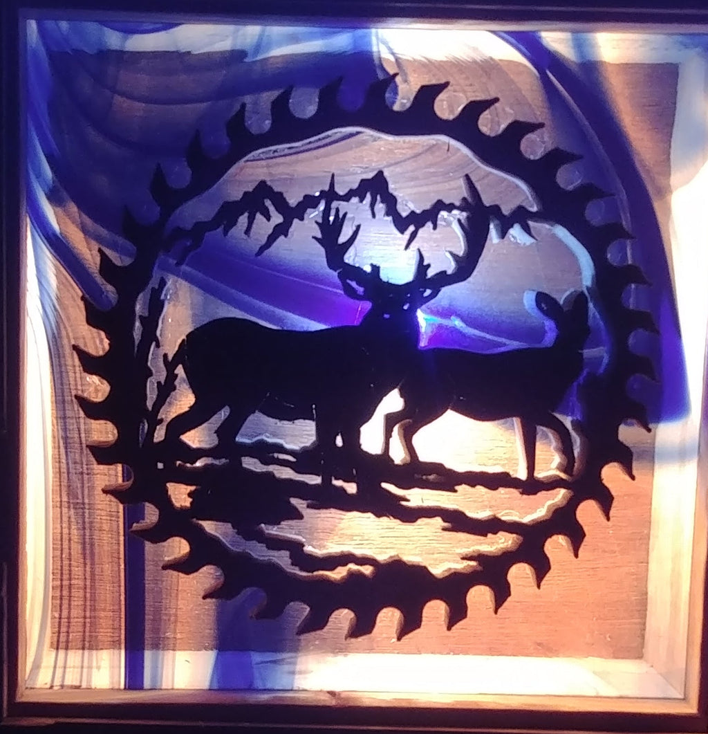 Lighted Shadow Box with scroll saw carving of an Elk Cow and Bull done by hand with a rustic wooden frame.
