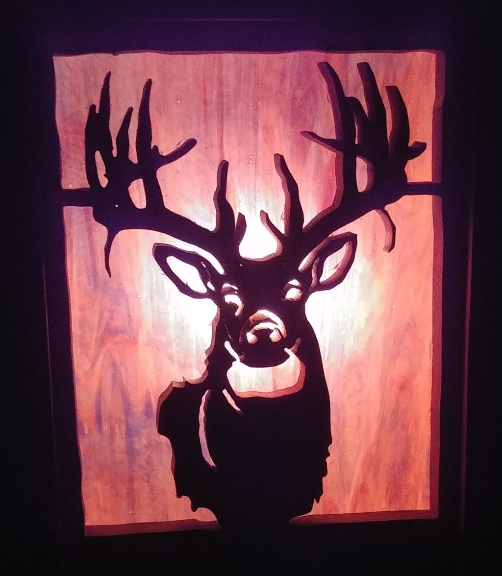 Lighted Shadow Box with scroll saw carving of a Elk done by hand with a rustic wooden frame.