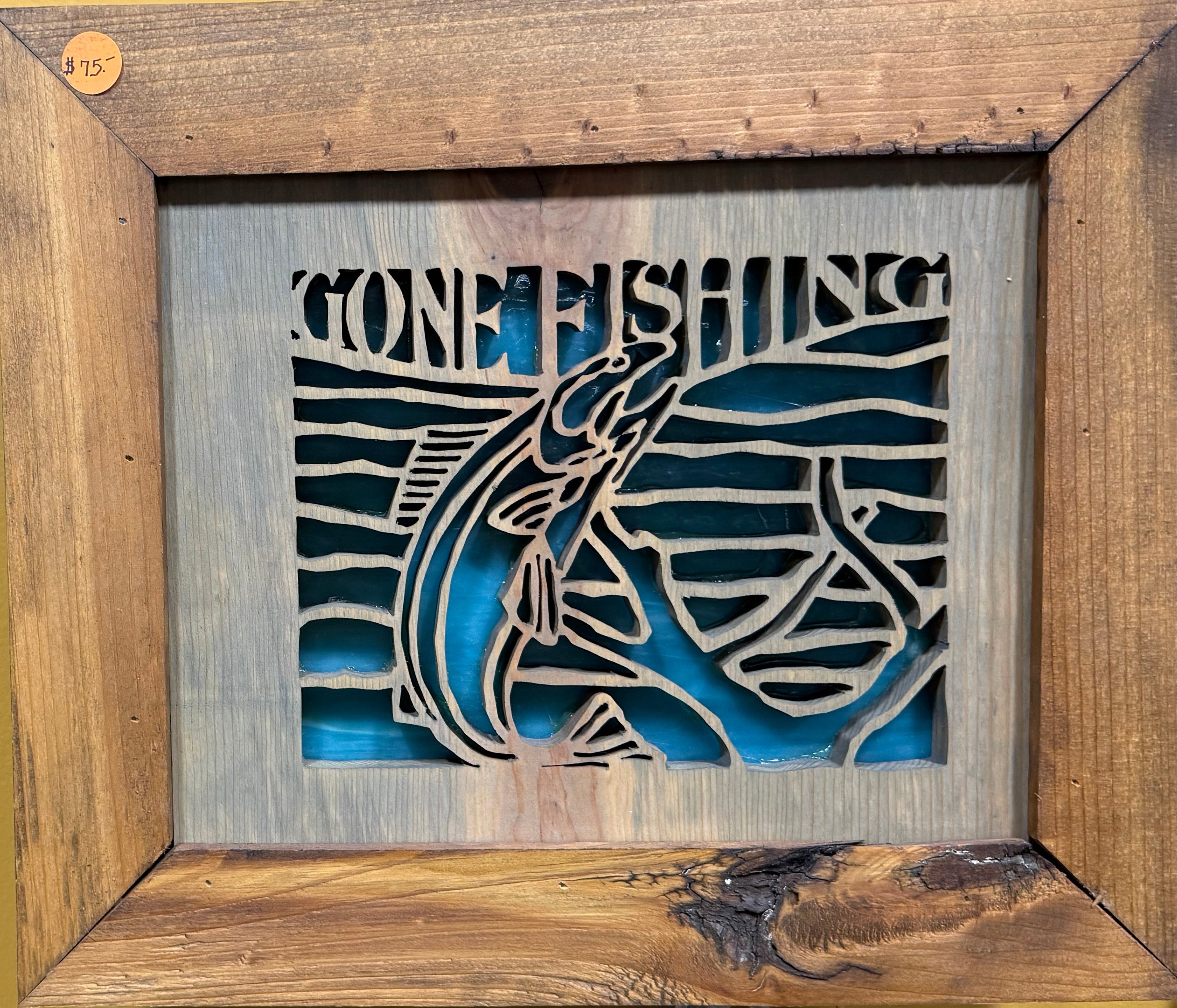 Lighted Shadow Box with scroll saw carving of a Fish and Lettering Gone Fishing done by hand with a rustic wooden frame.