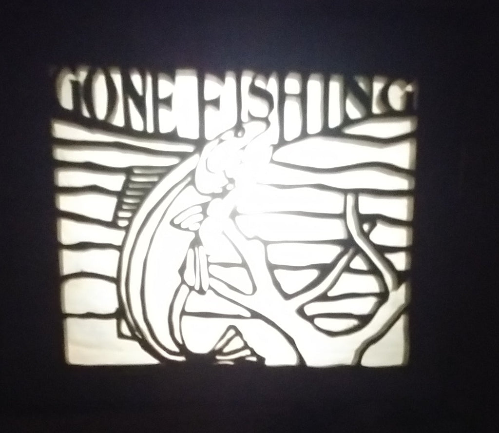 Lighted Shadow Box with scroll saw carving of a Fish and Lettering Gone Fishing done by hand with a rustic wooden frame.