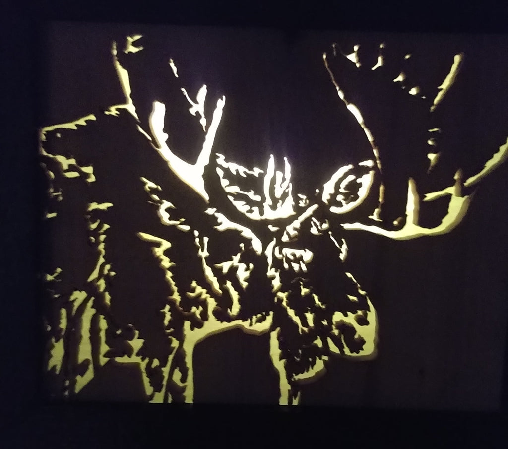Lighted Shadow Box with scroll saw carving of a Moose done by hand with a rustic wooden frame.
