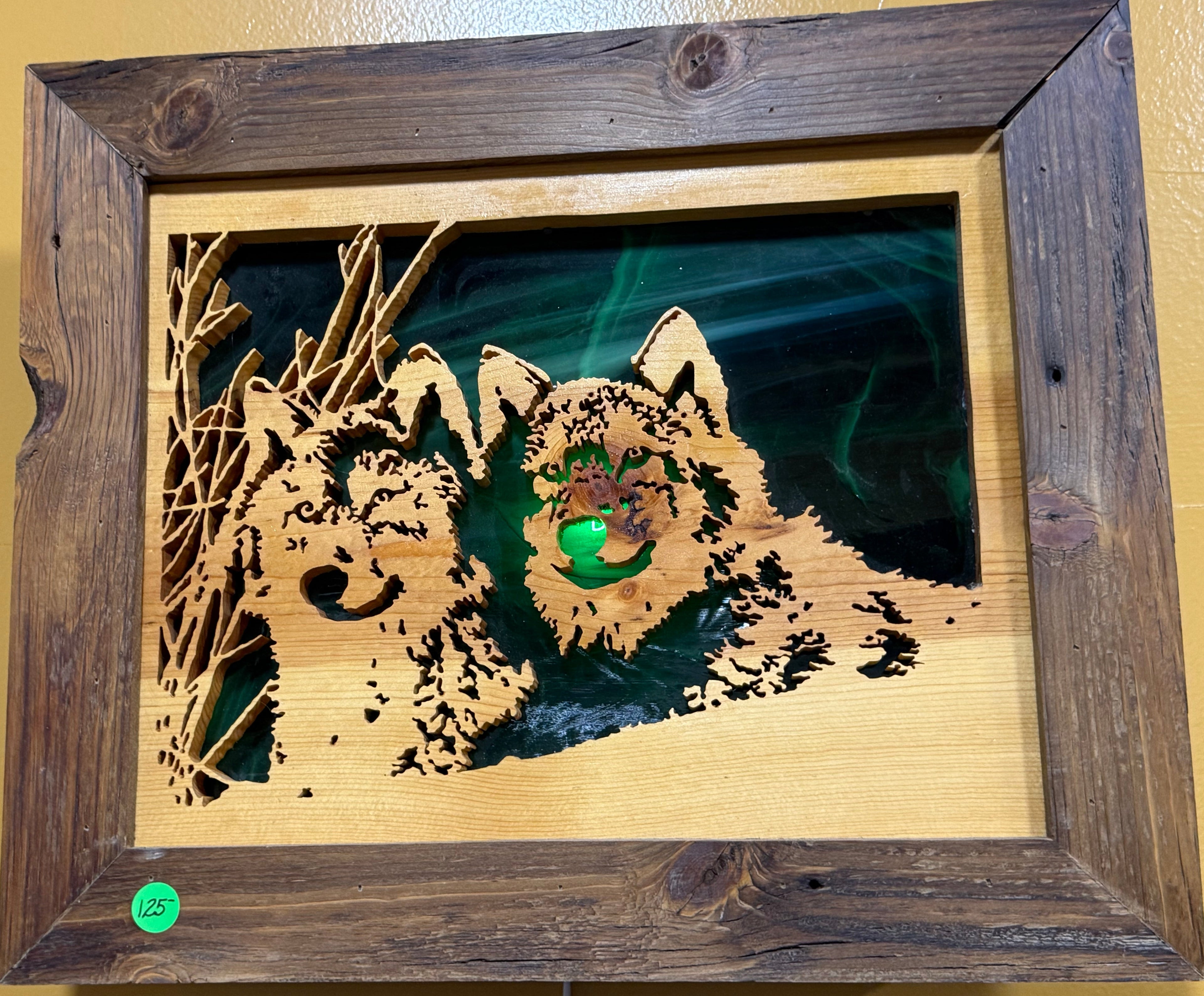 Lighted Shadow Box with scroll saw carving of a pair of wolves done by hand with a rustic wooden frame.