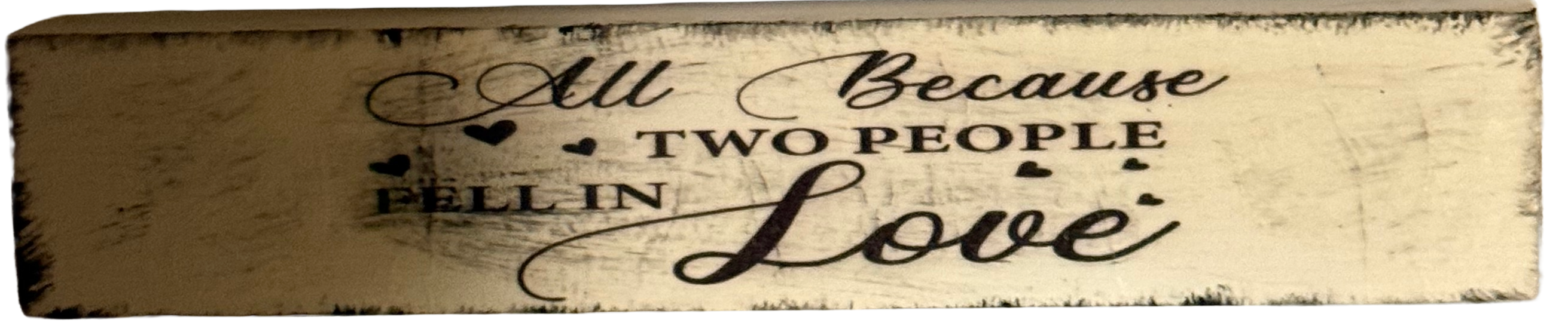 Wooden sign with engraved text on a white background