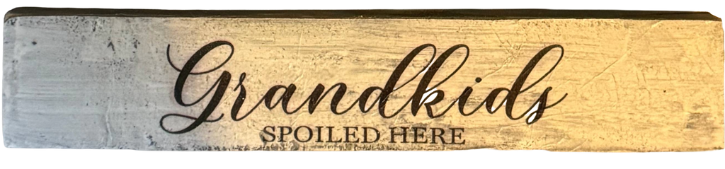 Wooden sign with 'Grandkids Spoiled Here' text on a white background