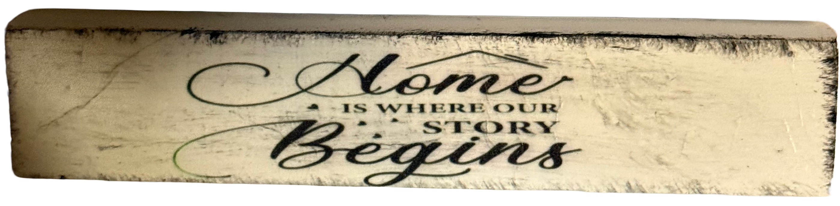 Wooden sign with 'Home is where our story begins' text on a white background