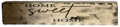 Decorative wooden sign with 'Home Sweet Home' text on a white background
