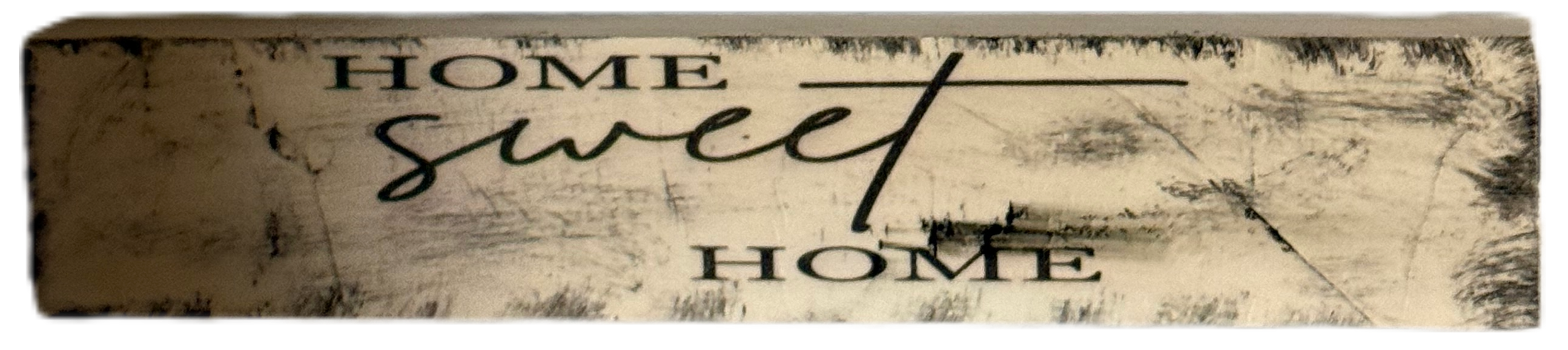 Decorative wooden sign with 'Home Sweet Home' text on a white background